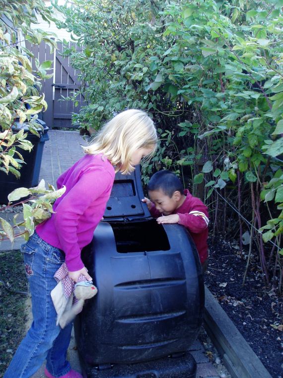 Ailsa and James check out the compost bin.
